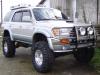 3rd gen 4Runner with raised bumpers and brush guard to match the lift along with Lift Lips wheel well liners to cover the gaps at the frame.