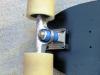 Front truck is one of the rebuilt Independent trucks with spherical bearing, Delrin pivot cut, aircraft bolt kingpin, and Riptide bushings, wedged 15 degrees..