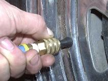 Slip chuck over valve stem and release